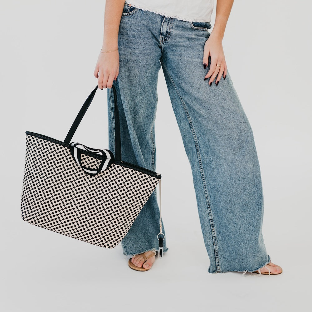 Checkered woven organizer tote bag with black handles and zipper pouch