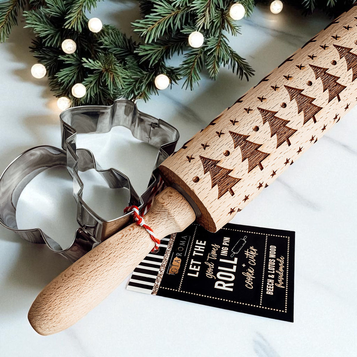 Wooden rolling pin with embossed Christmas trees pattern and striped tag