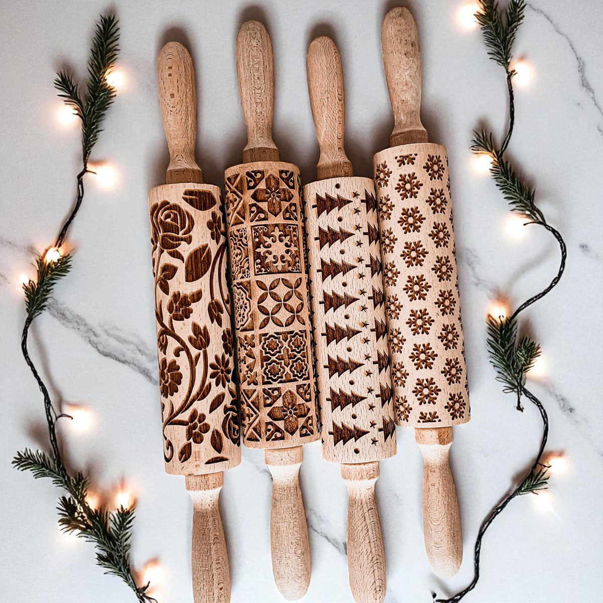 Set of Christmas rolling pins with different embossed holiday designs on wooden handles