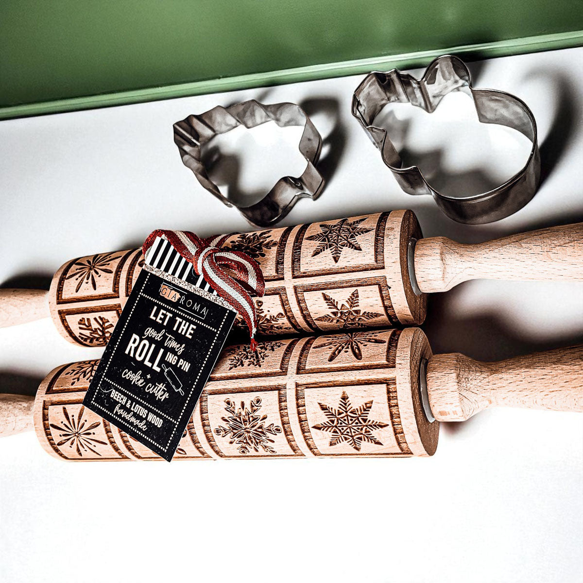 Christmas rolling pin set with engraved star and geometric patterns and metal cookie cutters.