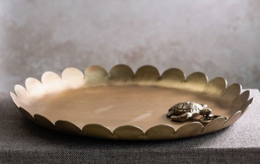 Antique brass serving tray with scalloped rim, round shallow dish