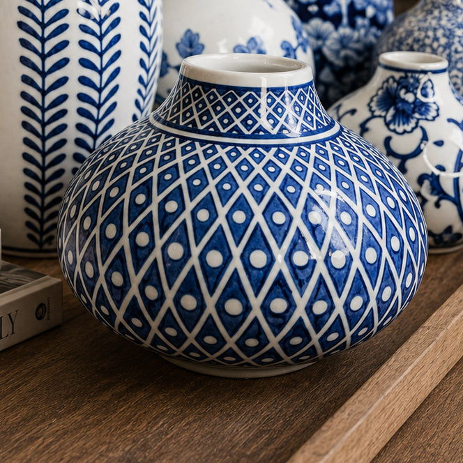 Blue and white ceramic vase with geometric diamond and lattice pattern