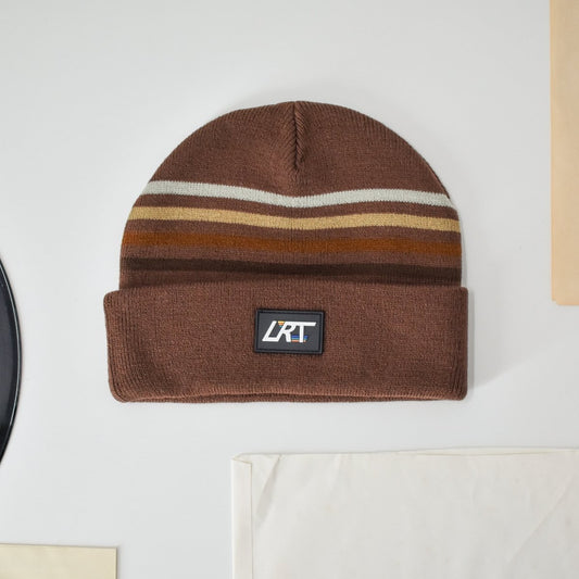 Brown knit beanie with horizontal multicolor stripes and RT logo patch on cuff