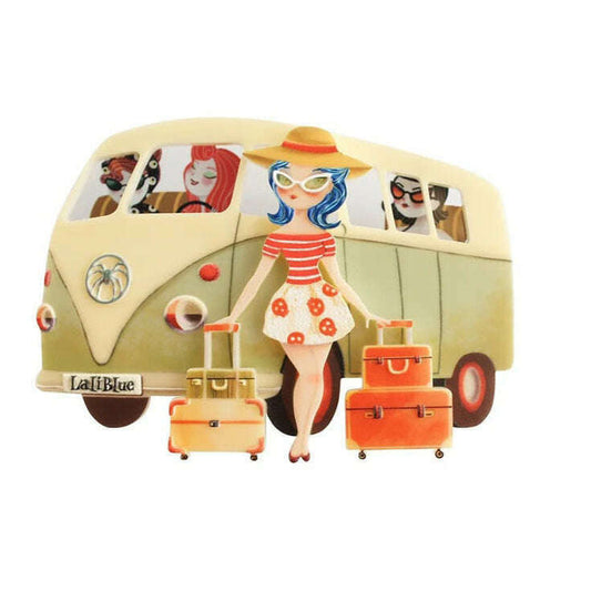Vintage van brooch with woman figure, suitcases, and red accents on cream car