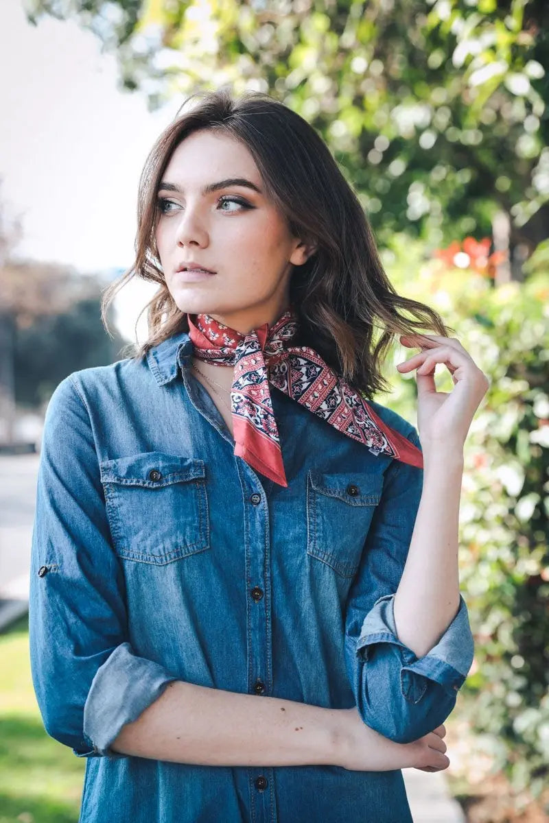 Vine motif bandana scarf, brick red paisley print, worn as neck scarf