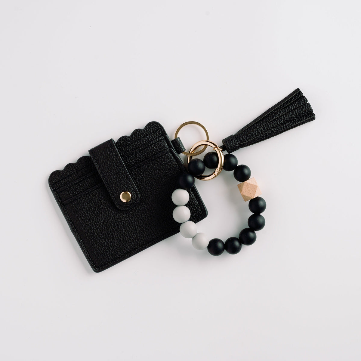 Black wallet wristlet keychain with tassel, beaded strap, and gold key ring