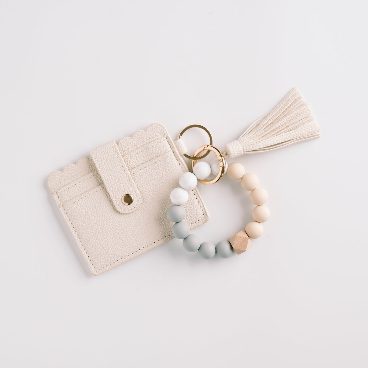 Ivory wallet wristlet keychain with tassel, beaded strap, and gold key ring