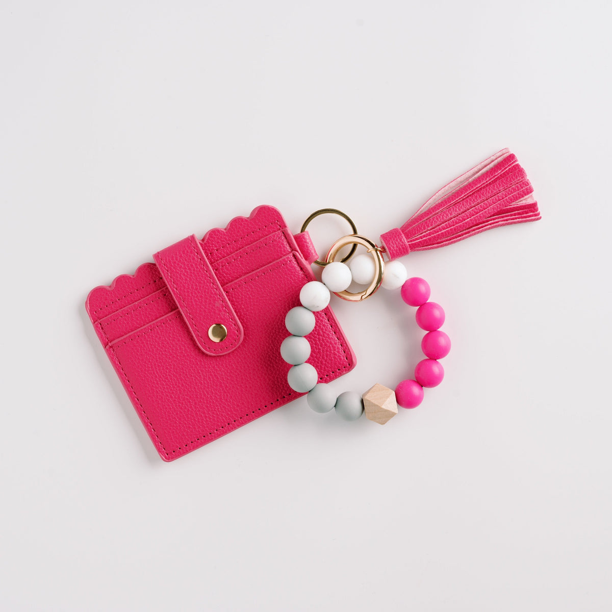 Fuchsia wallet wristlet keychain with tassel, beaded ring, and key clasp