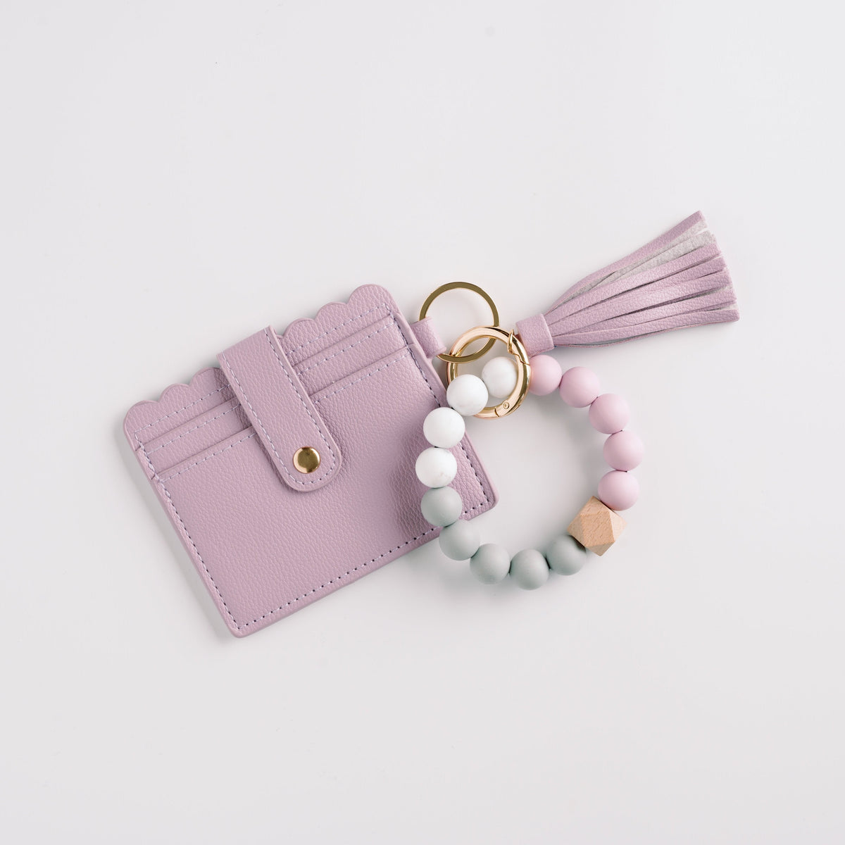 Lilac wallet wristlet keychain with tassel, beaded strap, and gold key ring