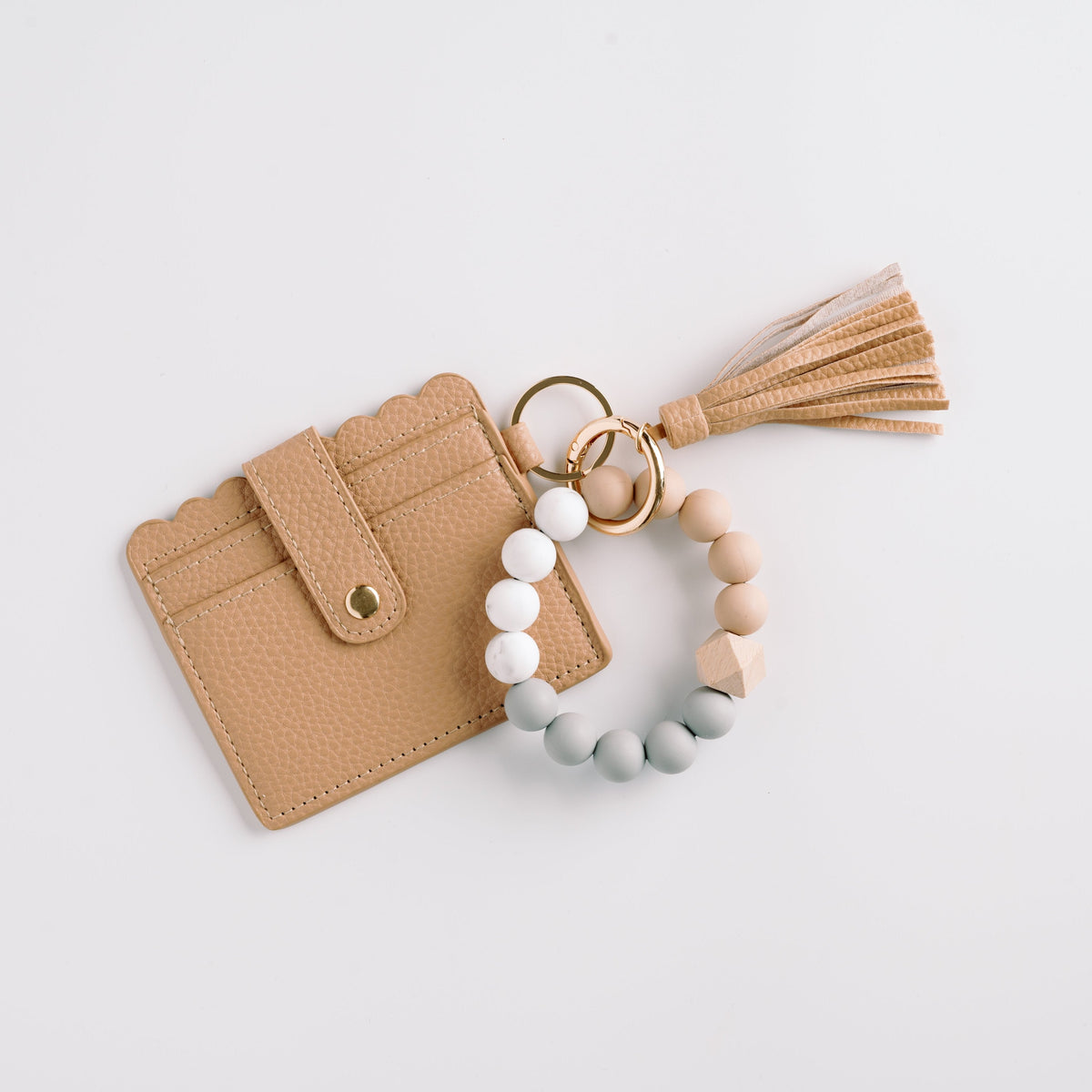 Tan wallet wristlet keychain with tassel, beaded strap, and gold key ring