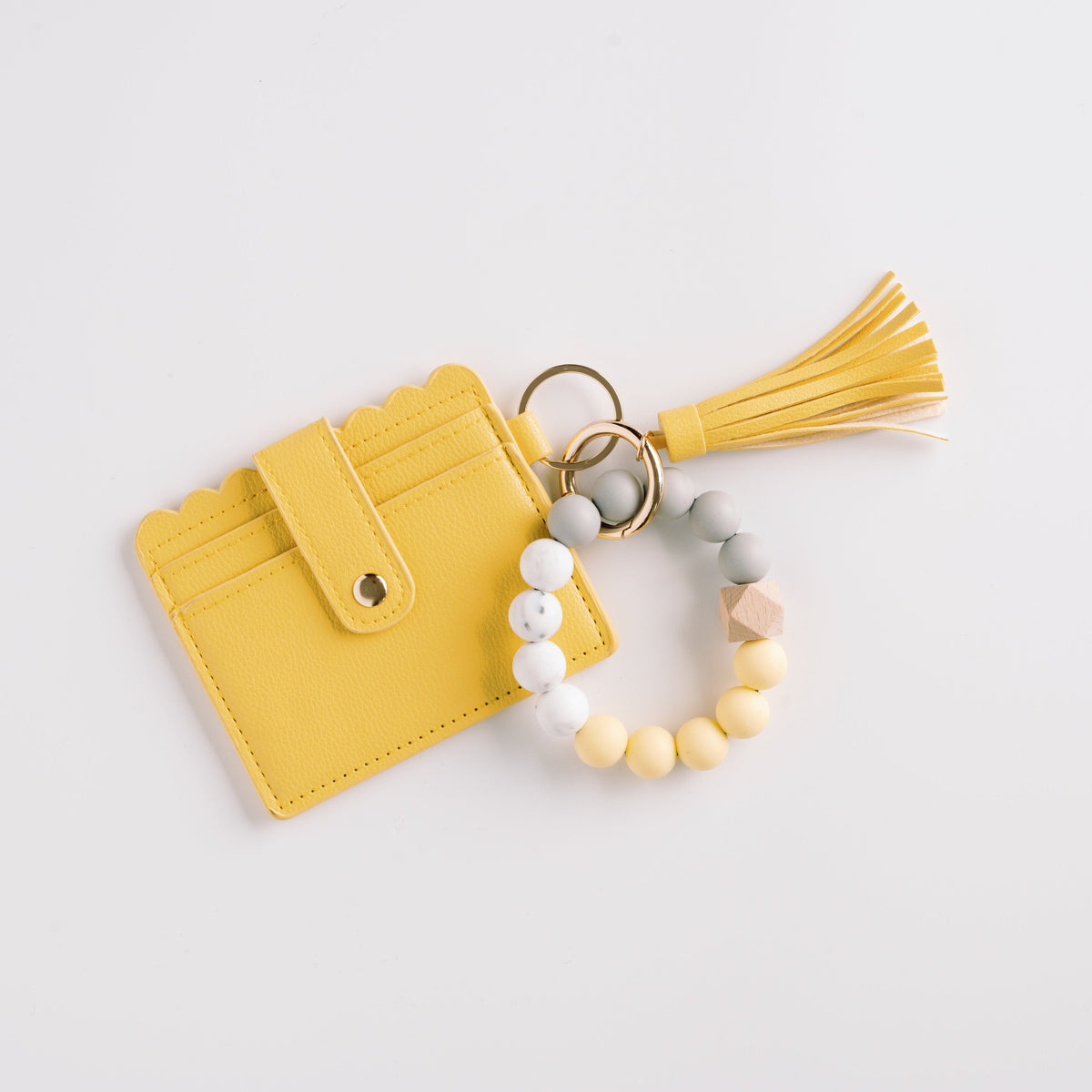 Yellow wallet wristlet keychain with tassel, beaded strap, and gold key ring