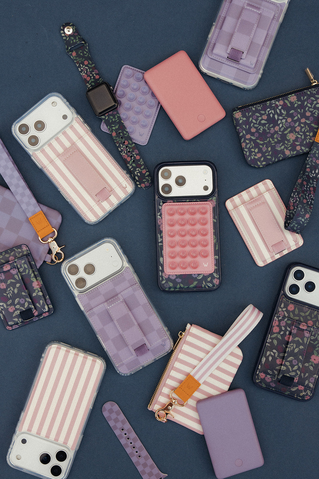 Assorted patterned and striped zippered pouches with wrist straps