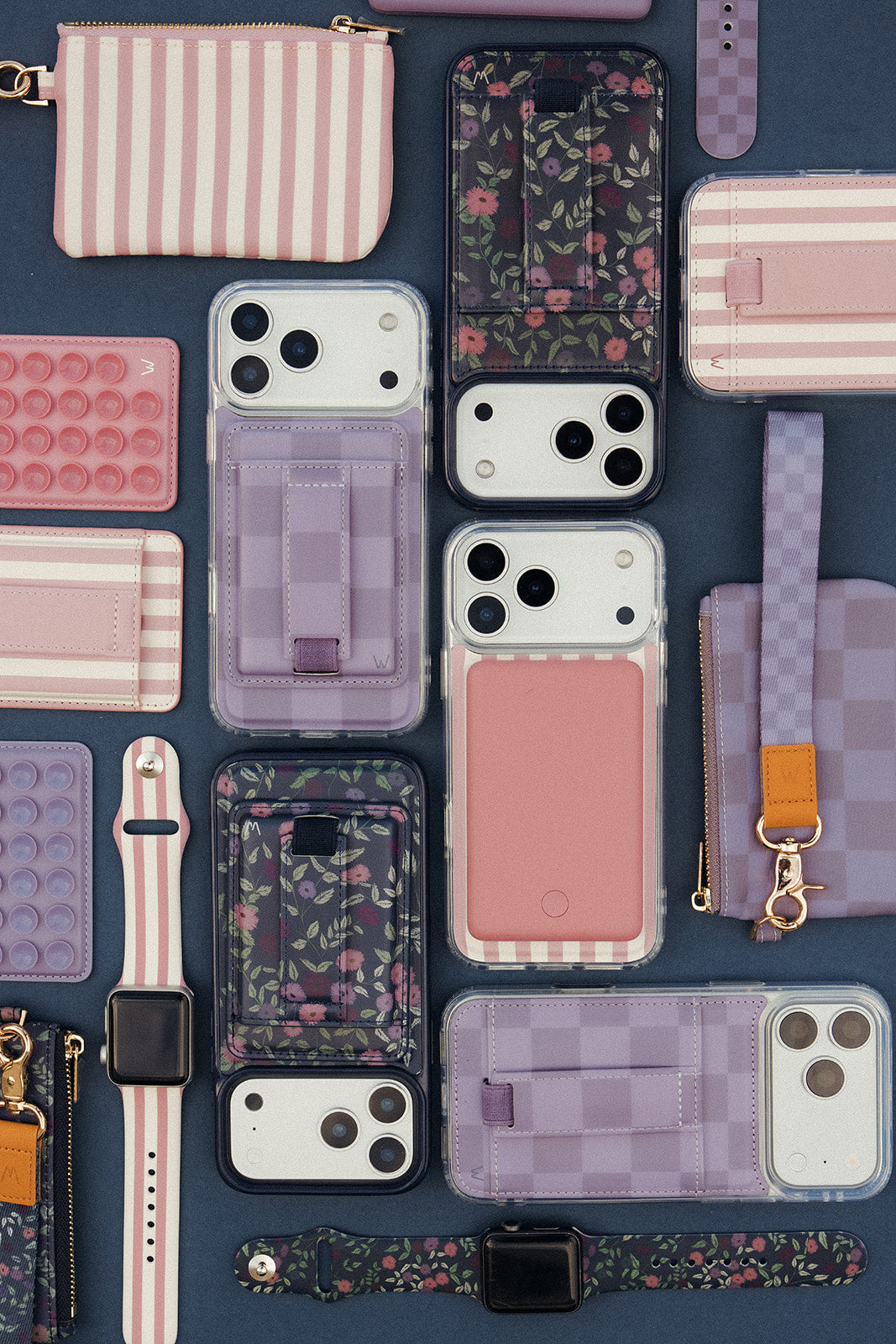 Close-up of assorted zippered phone pouches in pink and purple colors