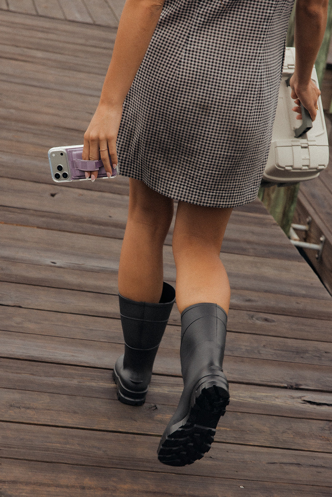 Lavender magnetic phone wallet with card slots on a smartphone, held at side.