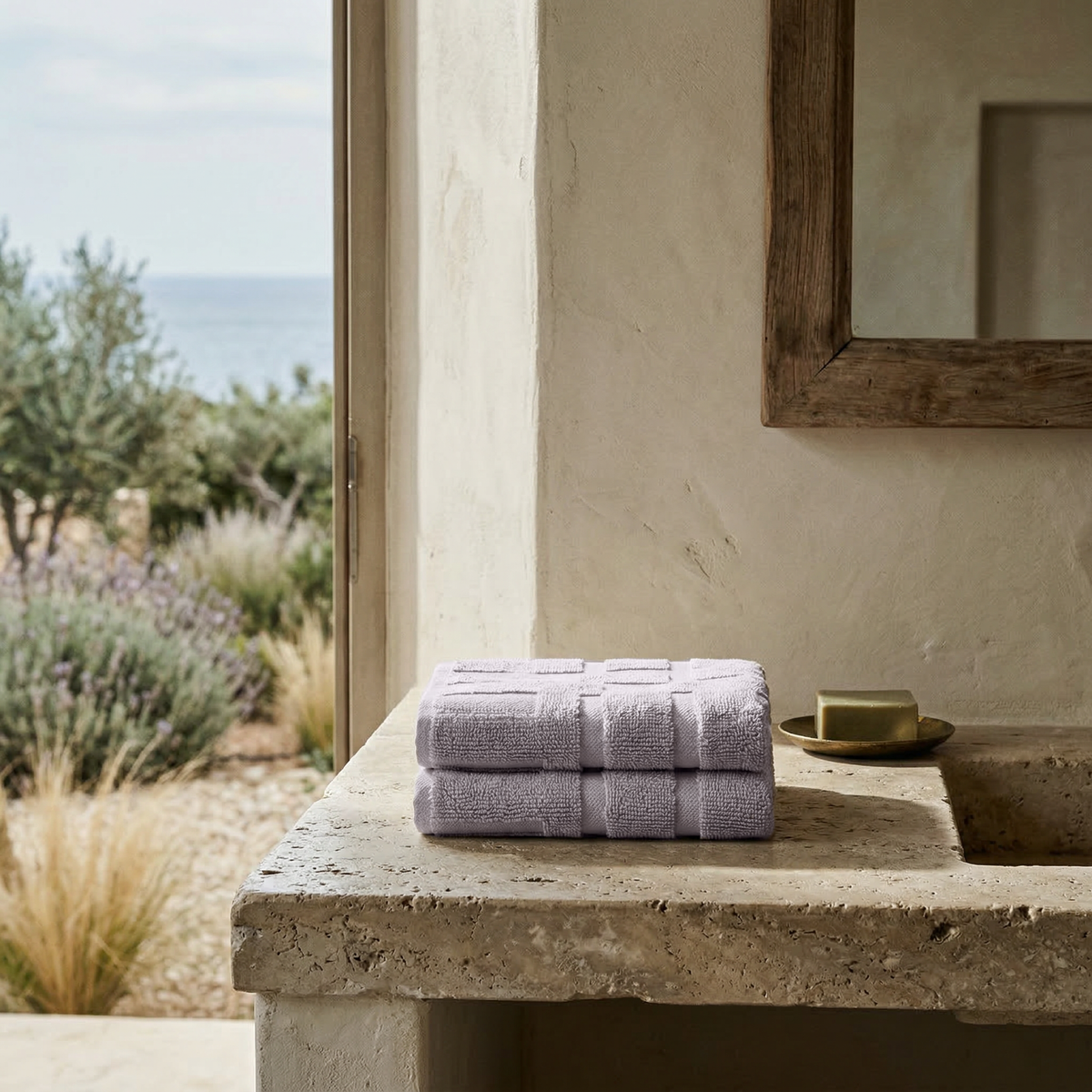 Australian cotton towel, lilac, folded on a countertop