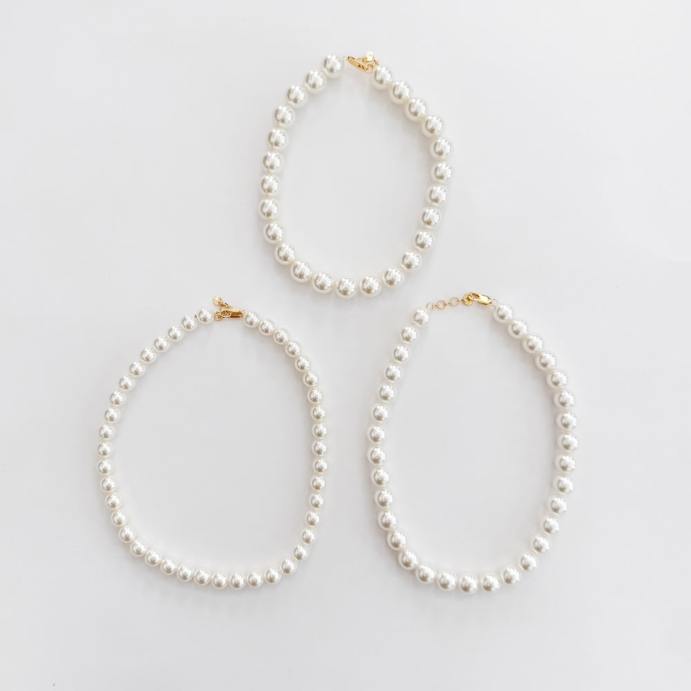 Pearl necklace set of three teardrop loops, white pearls with gold-tone tips