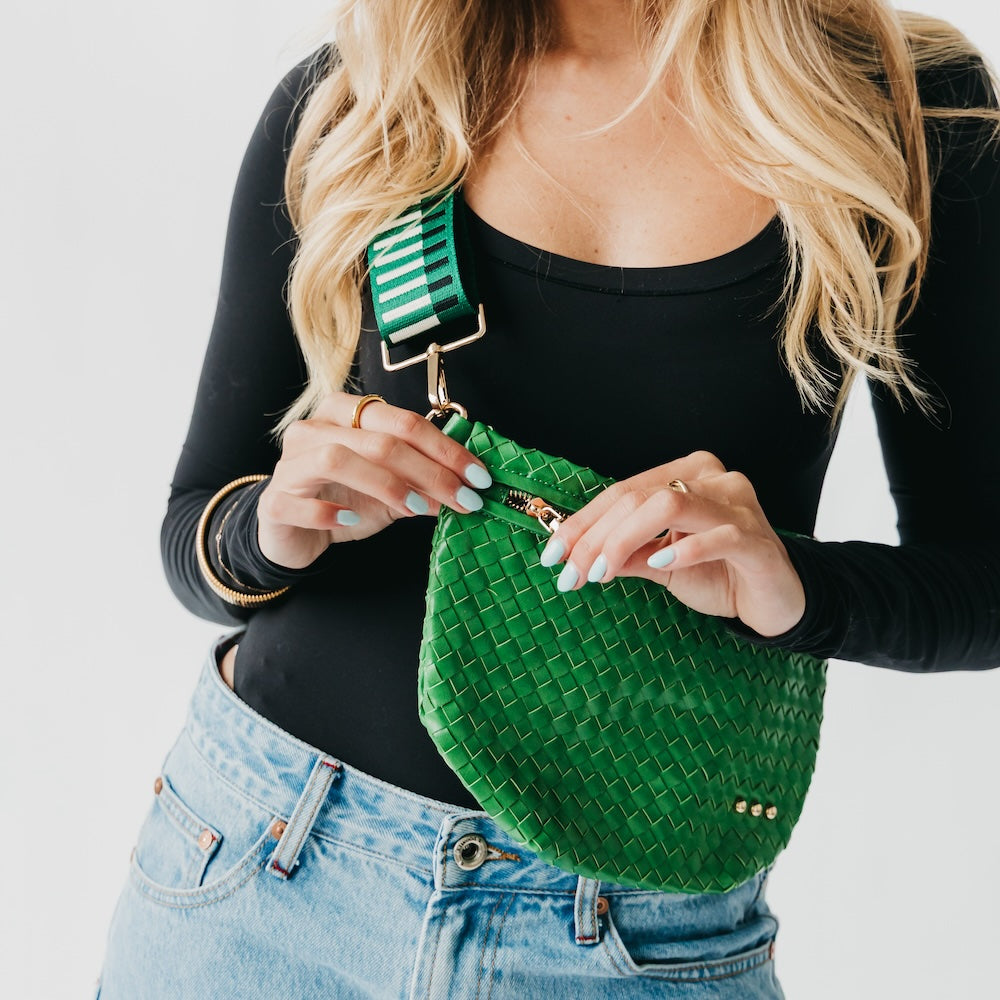 Woven bum bag in green with braided check texture, gold-tone buckle strap, zip top.