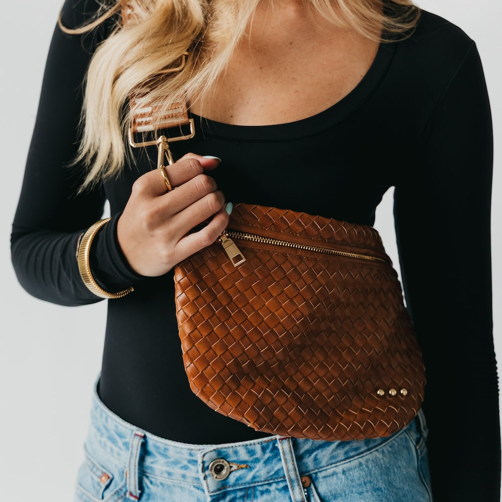 Westlyn woven bum bag in brown woven checkers, gold zipper and small button tab