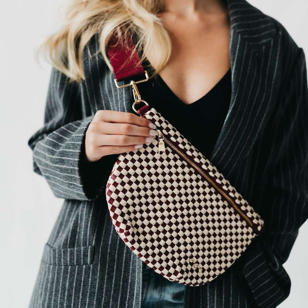 Westlyn woven bum bag, cream-and-black checkered with gold zipper and crossbody strap