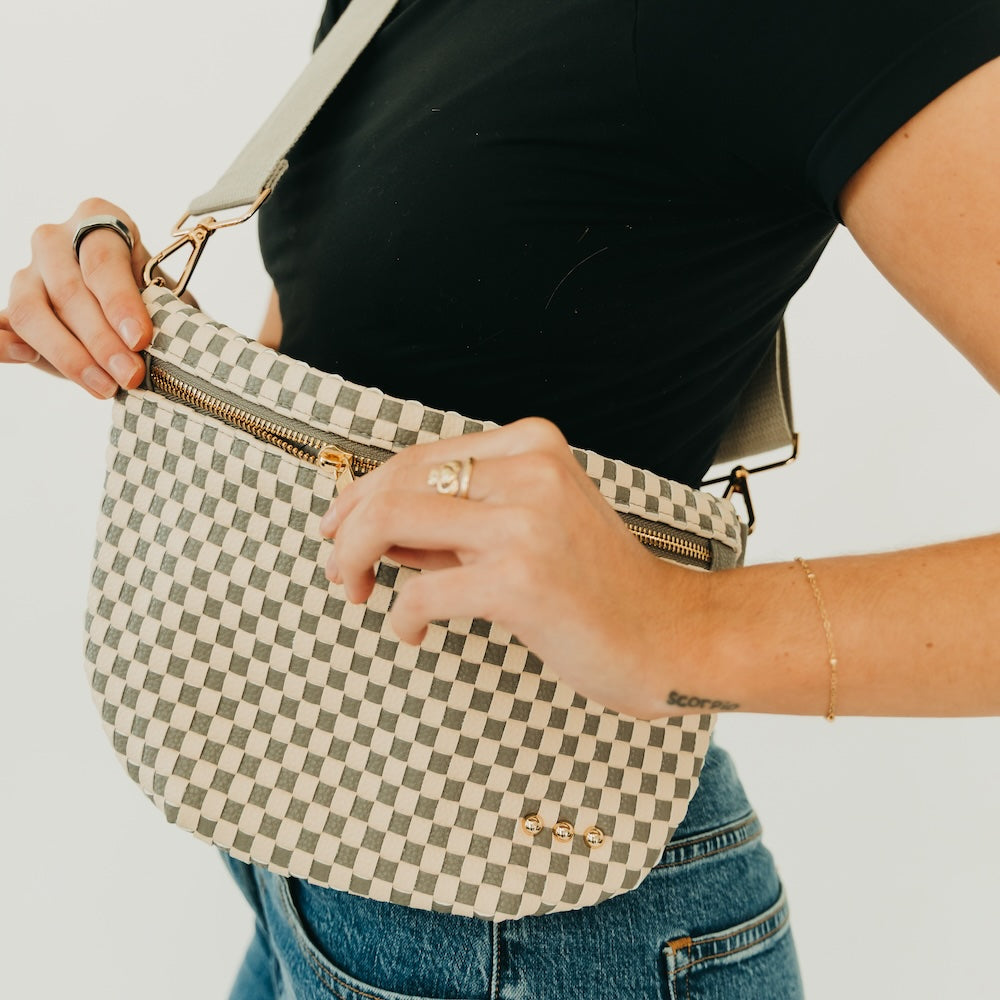 Westlyn woven bum bag, cream-and-black checkered with gold zipper and adjustable strap