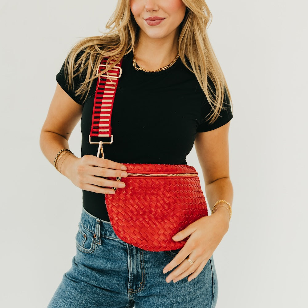 Red woven bum bag with top zipper and adjustable strap