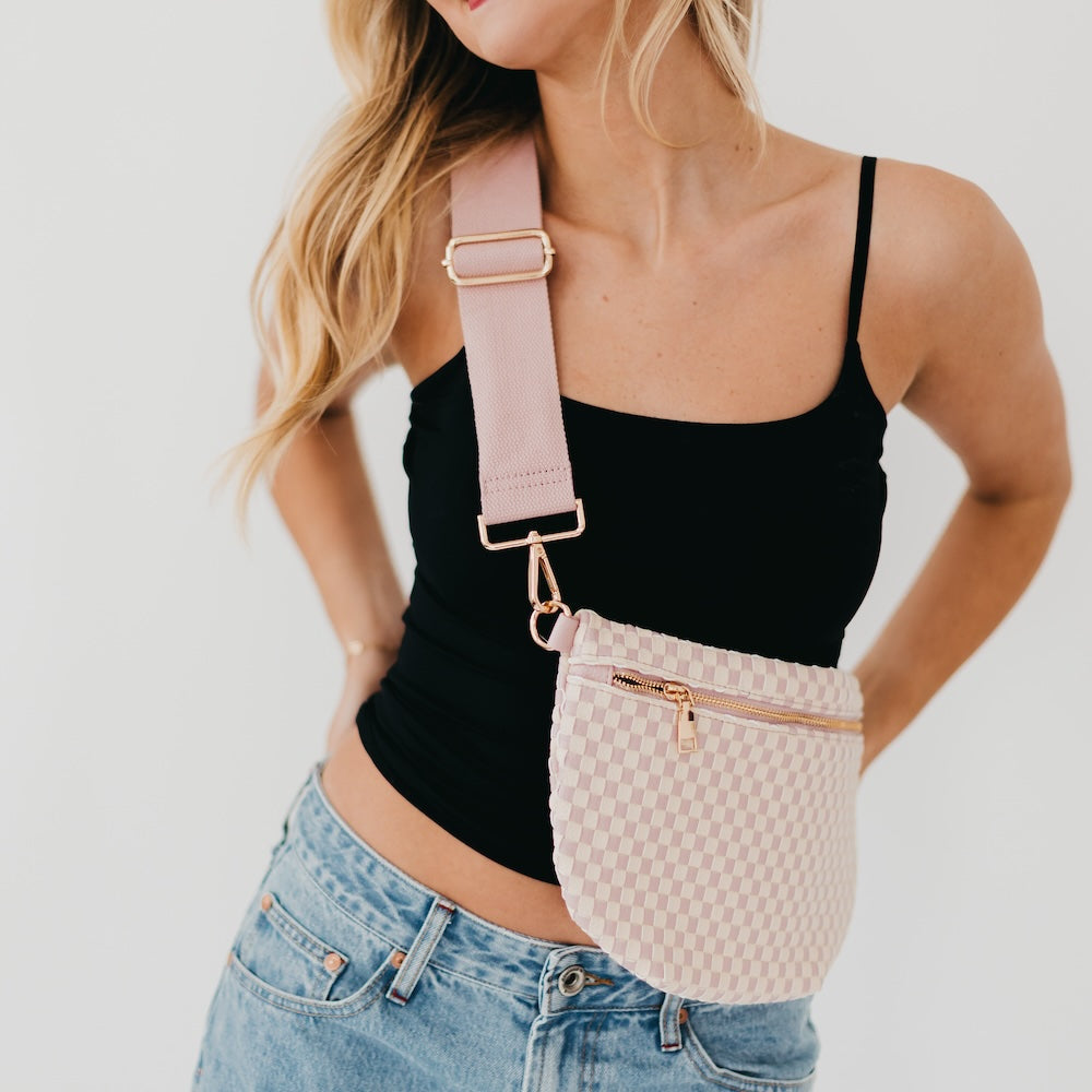 Westlyn woven bum bag in pale pink checker pattern with gold zipper and strap ring