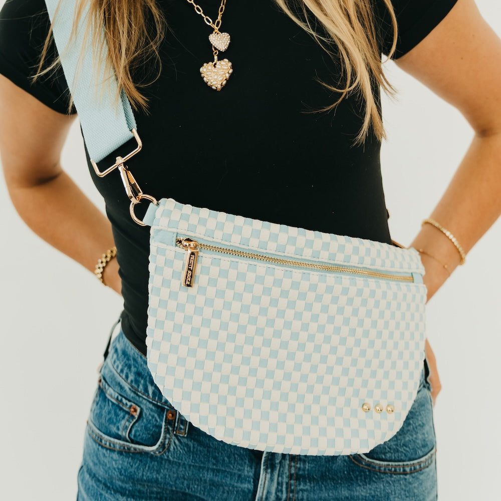 Woven bum bag in light blue check, gold chain strap, front zip closure.