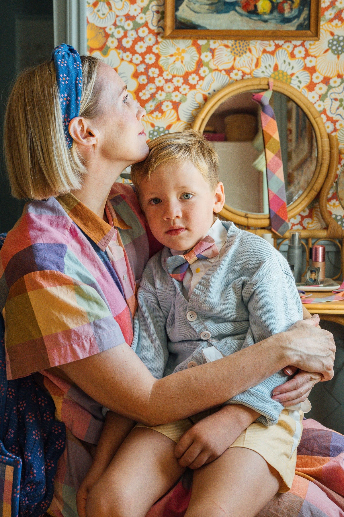 Plaid bow tie on child’s shirt, pastel check pattern at the neckline