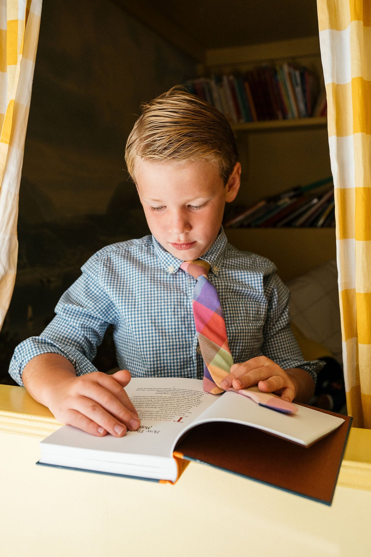 Boys plaid necktie with multicolor block pattern worn with blue check shirt