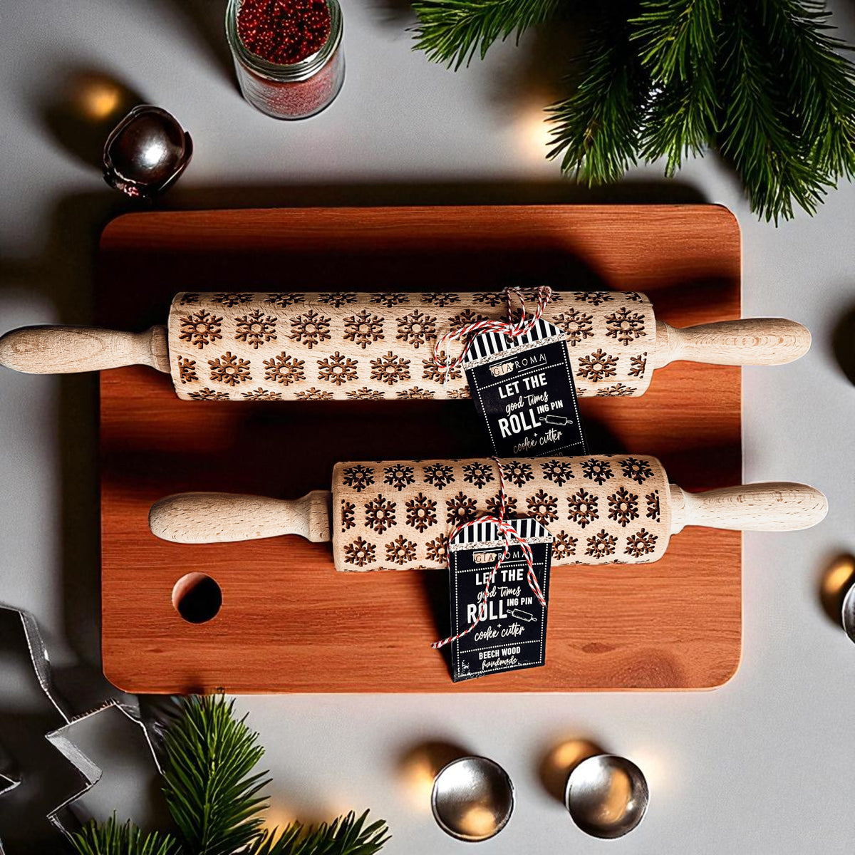 Wooden Christmas rolling pin with embossed snowflake pattern and tag on handle