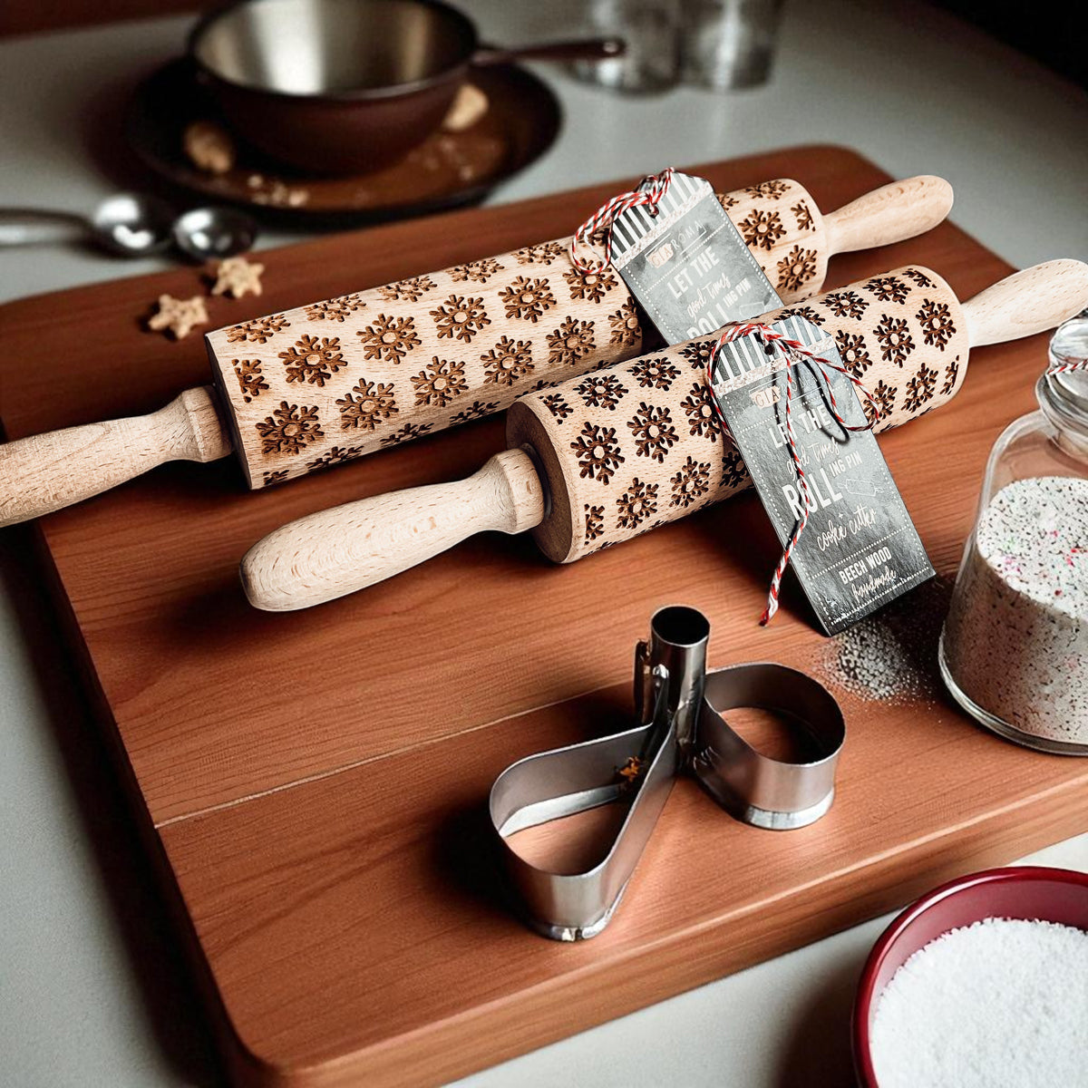 Christmas rolling pin set on a tray with assorted brown patterned barrels and cookie cutters