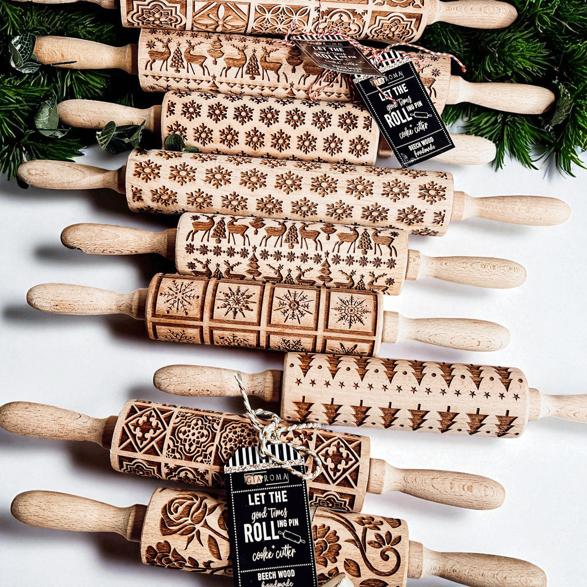Christmas rolling pin set featuring embossed deer, snowflake and tree patterns on wood