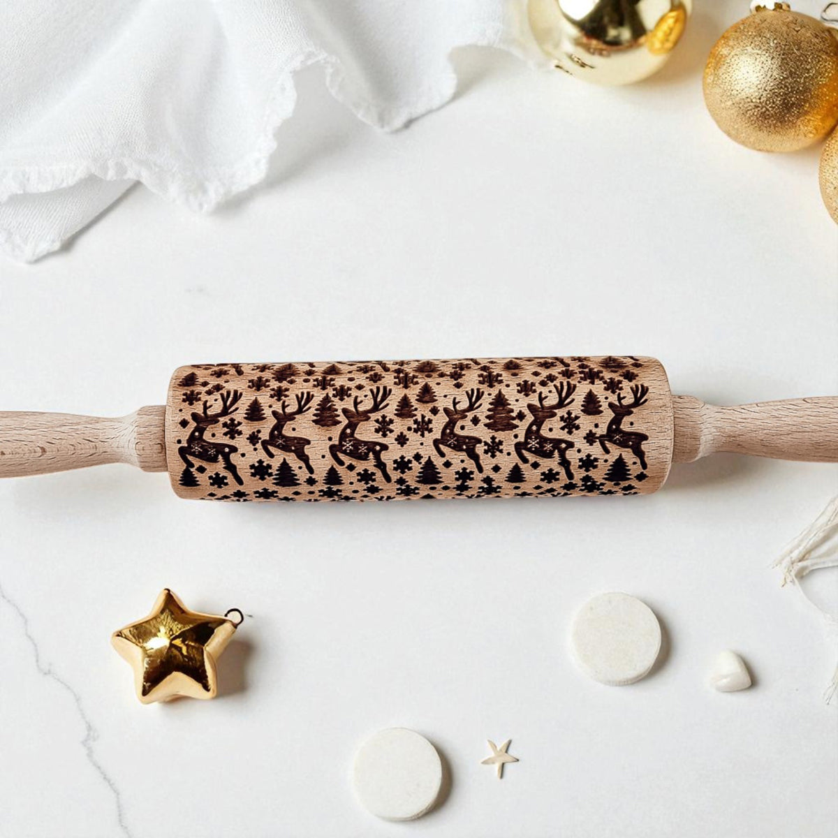 Wooden Christmas rolling pin with dark pine-and-deer icon pattern on the barrel.