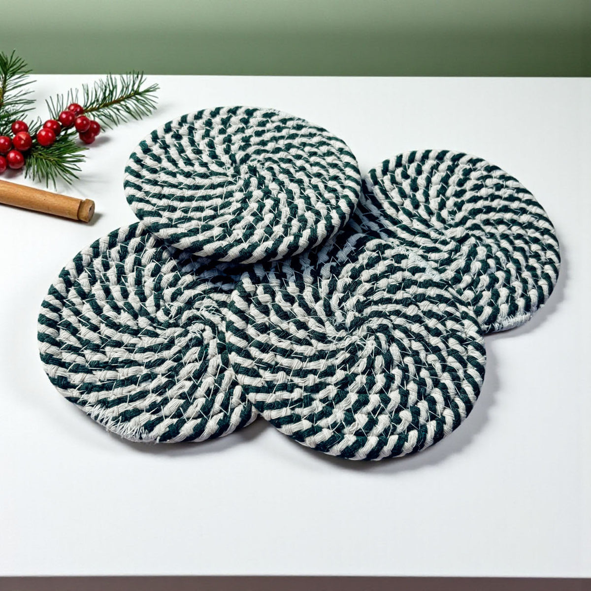Round woven coasters with navy-and-white striped pattern, three-piece arrangement