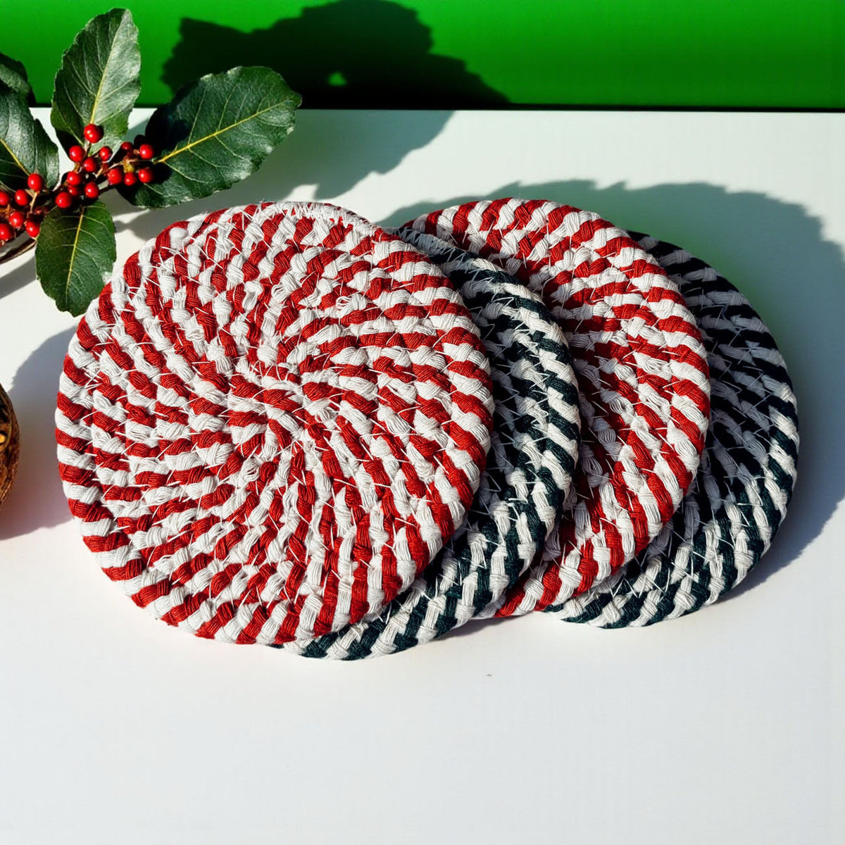 Candy cane coasters, red and white spiral rope with dark green accents (pair)