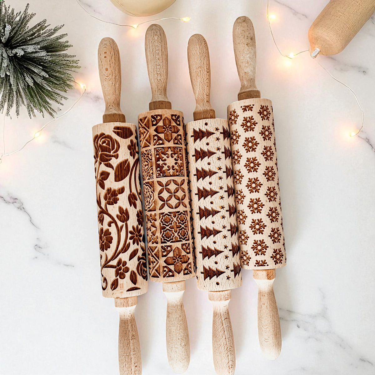 Christmas rolling pin set with four carved rollers in different holiday patterns.