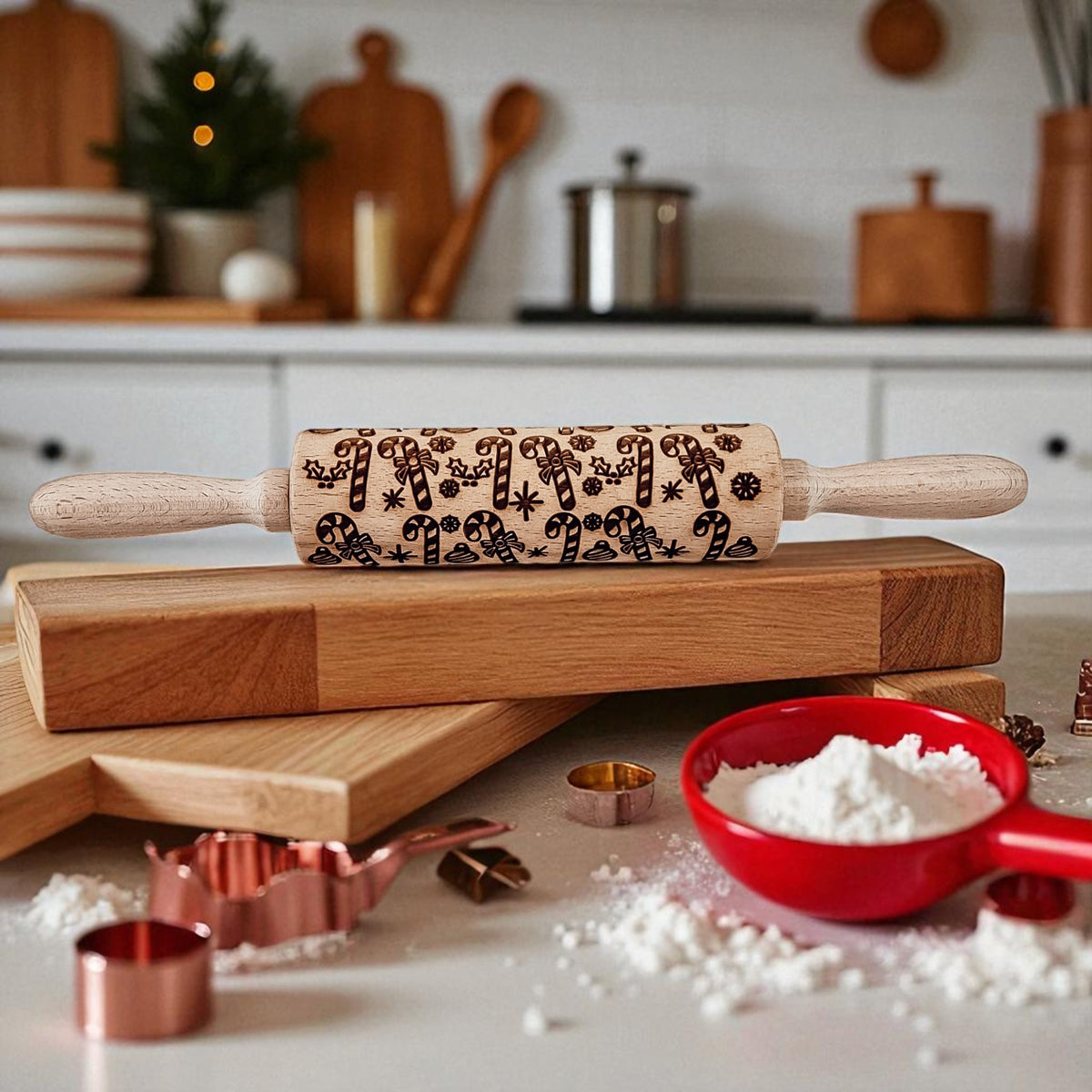 Christmas rolling pin with dark holiday motif on a wooden board with flour.