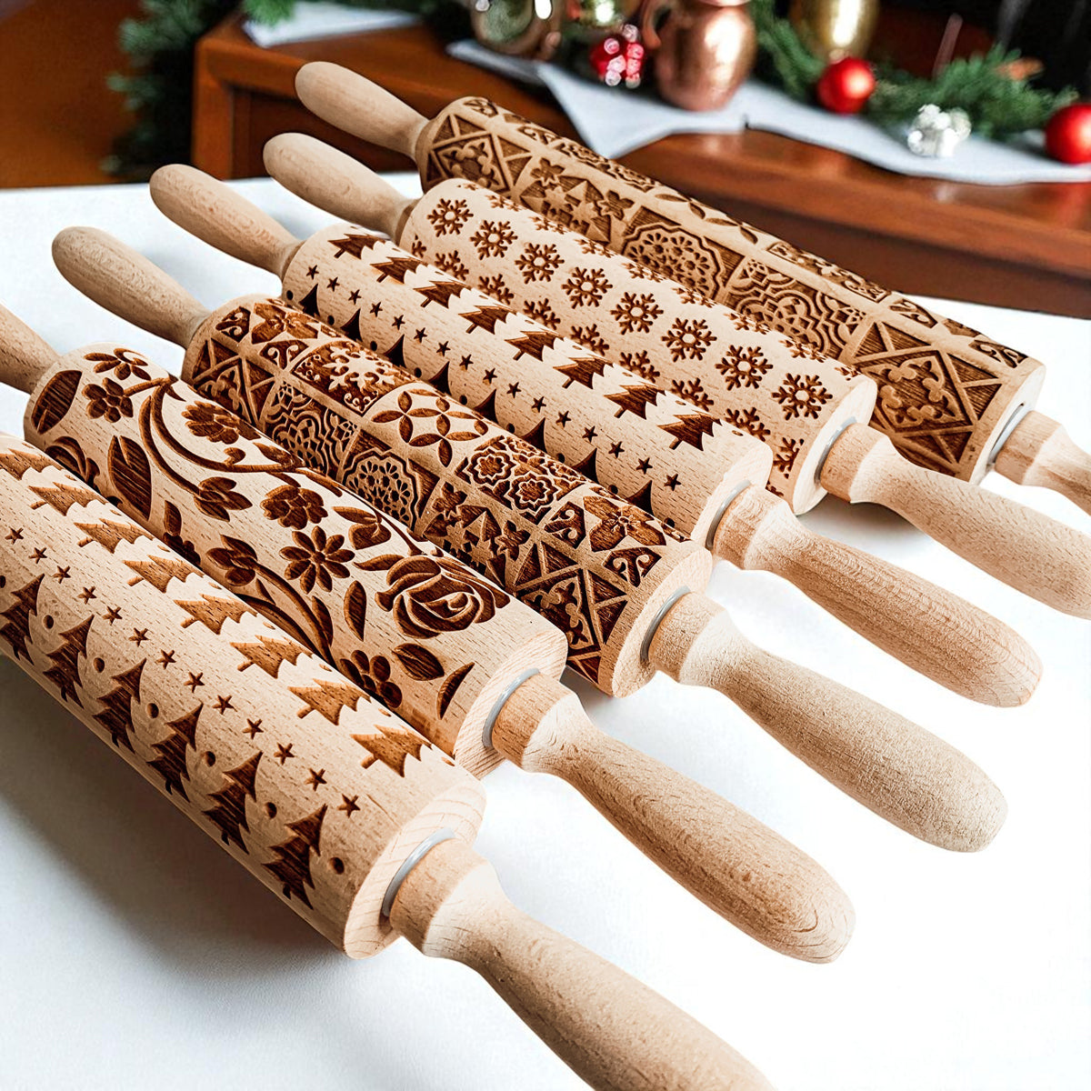 Christmas rolling pin set with multiple carved barrels featuring winter holiday patterns.