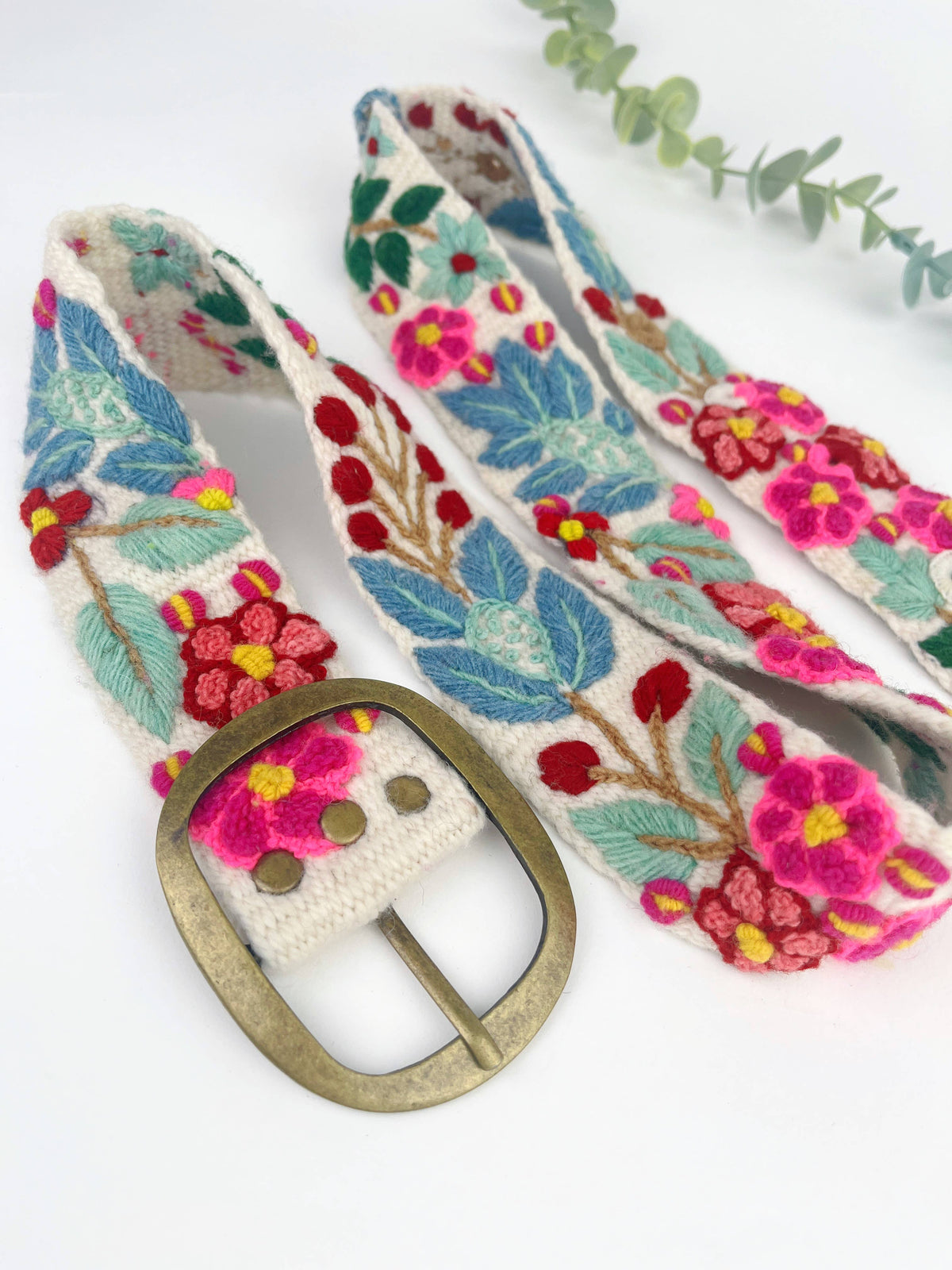Cream embroidered wide belt with colorful floral pattern and brass oval buckle