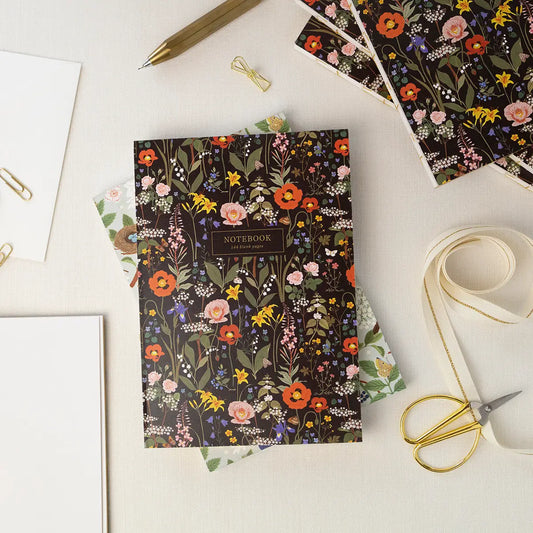 Deluxe notebook with a dark cover covered in colorful wildflowers