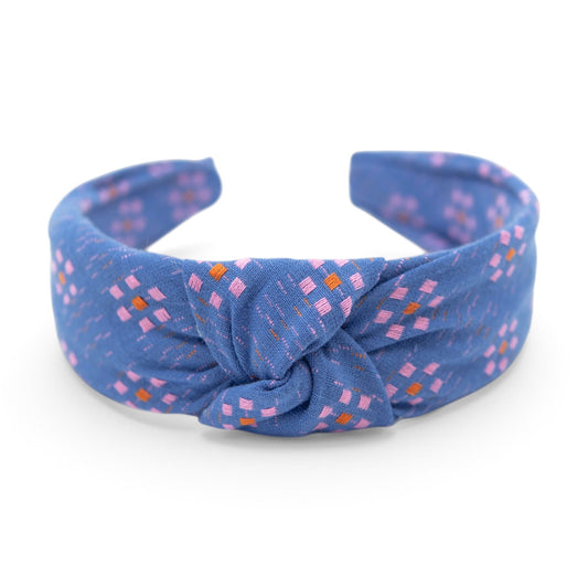 Blue knotted headband with small pink and orange floral pattern, 1.5 in thick