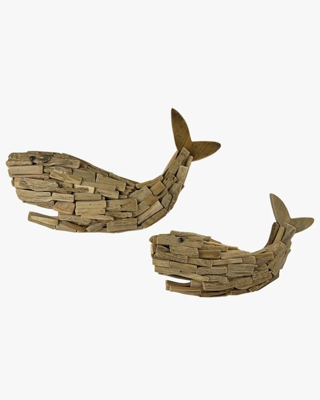 Pair of wooden whale wall decorations with layered wood pieces and raised tails.