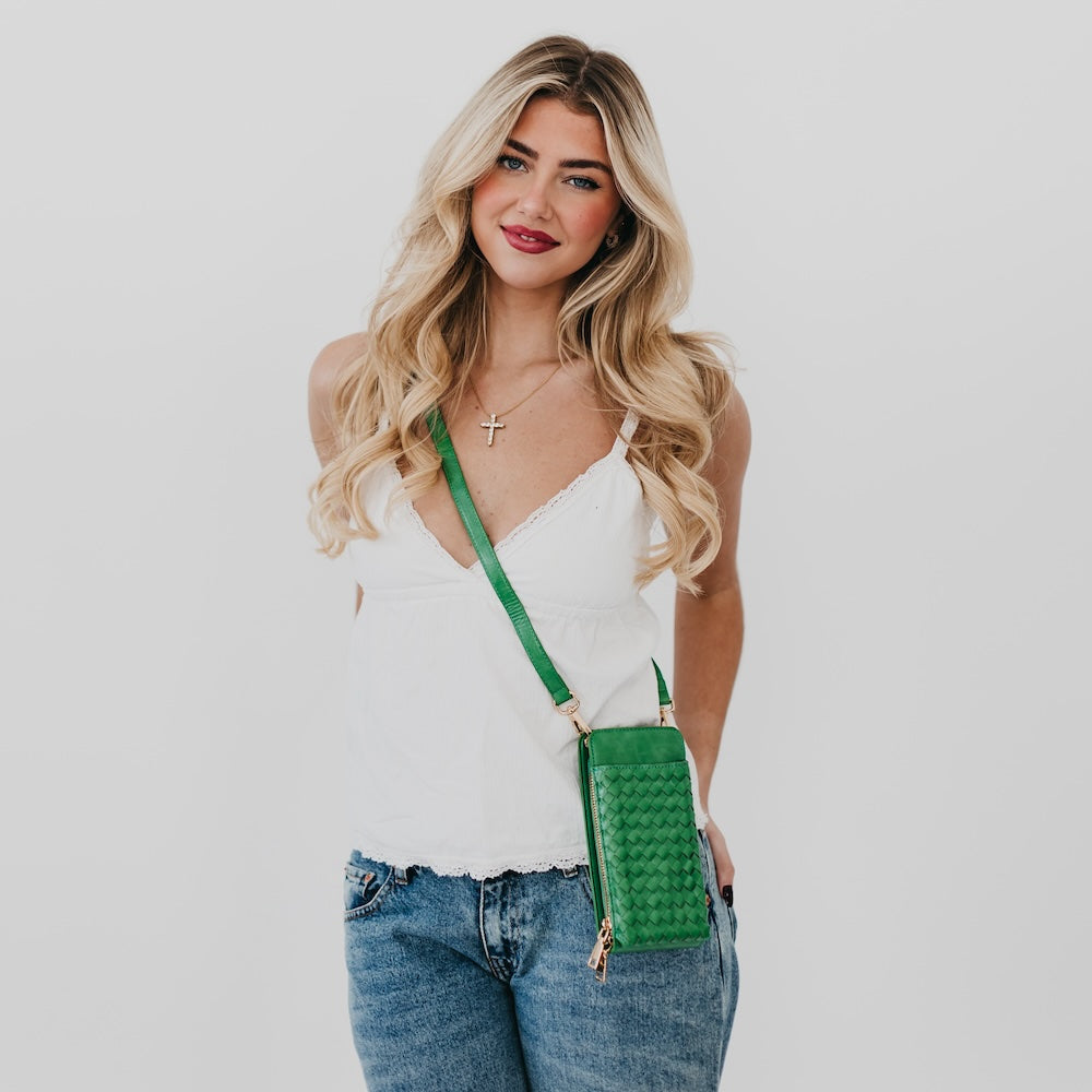 Woven phone bag in green with crossbody strap and textured woven front