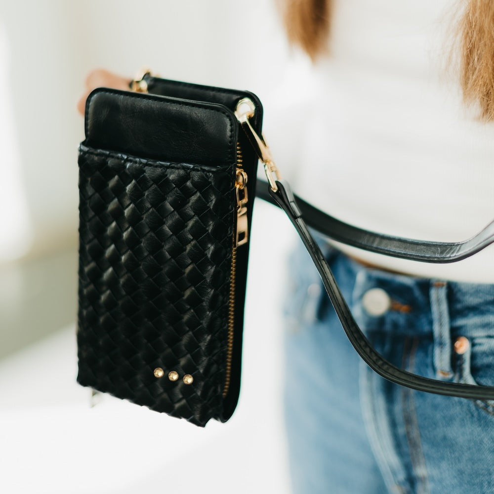 Woven double-duty phone bag with black quilted diamond weave and gold studs