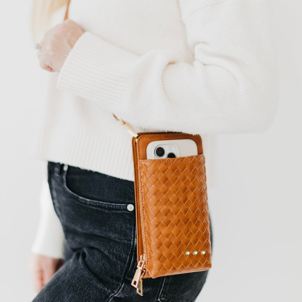 Woven double-duty phone bag with orange woven front and gold zipper pull