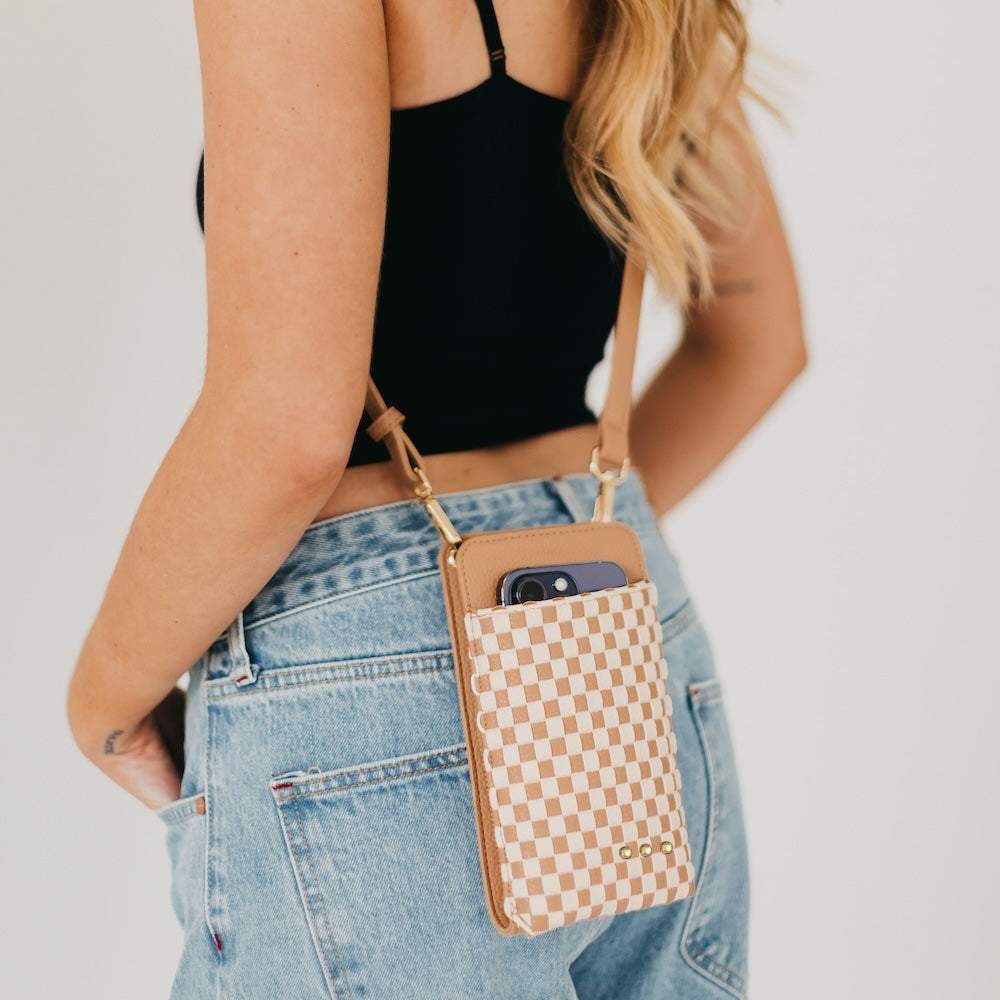 Woven double-duty phone bag with tan and brown checker pattern and gold studs