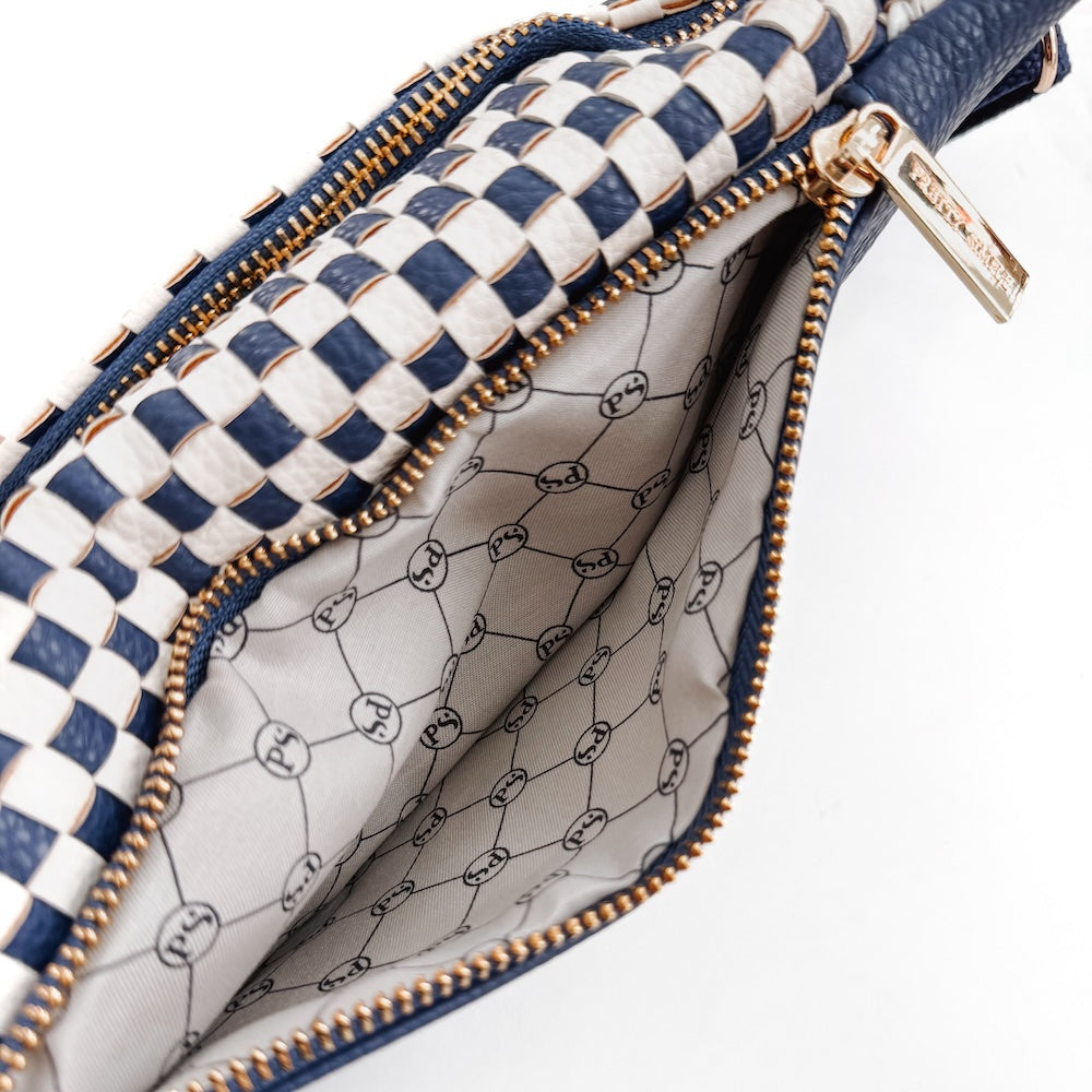 Woven bum bag with navy-and-white check outer and gold zipper; open interior view.