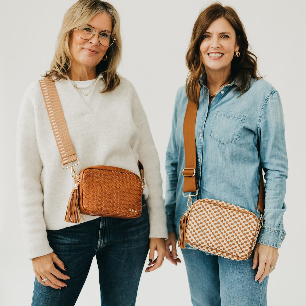 Woven camera crossbody bag in brown with tassel and tan adjustable strap
