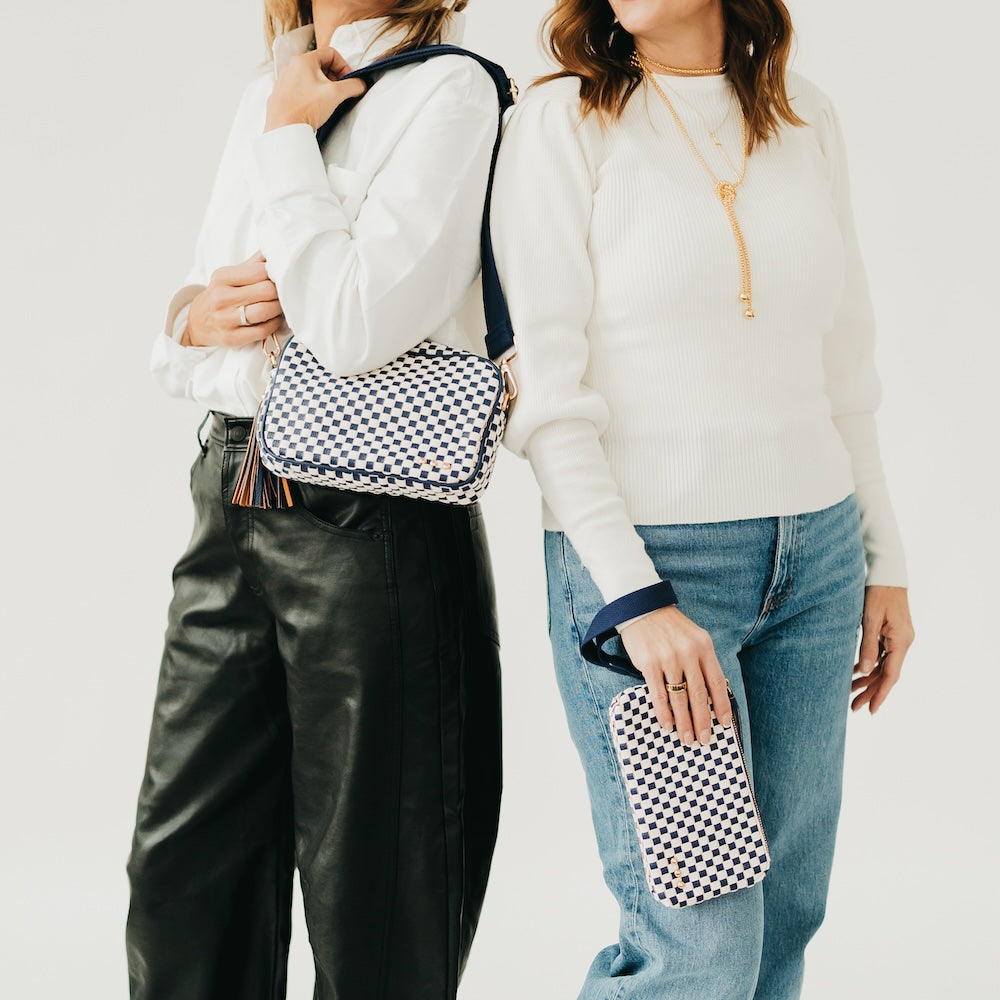 Blue-and-white checkered woven crossbody bag with tassel and adjustable strap