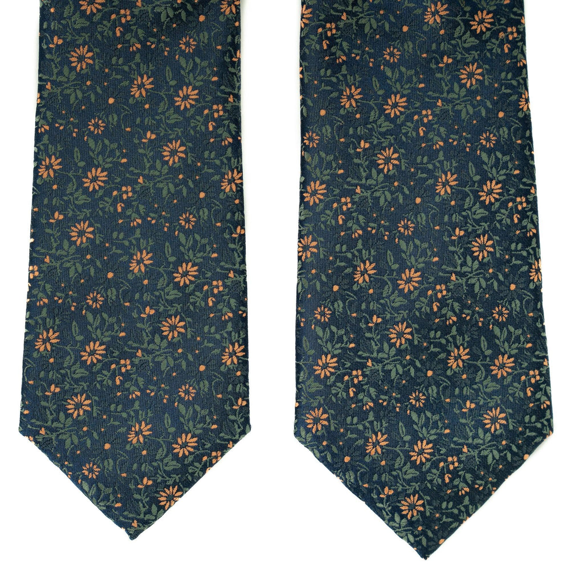Two views of dark teal necktie with repeating orange floral and leaf pattern.